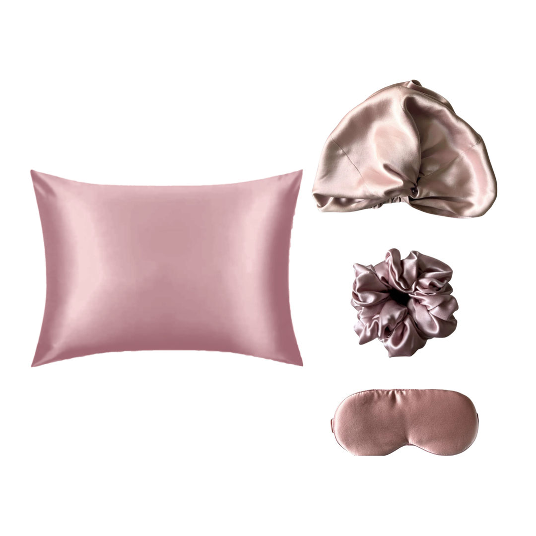 The Silk Rituals Overnight Bundle in Blush Pink: silk pillowcase, hair bonnet, eye mask and classic scrunchie