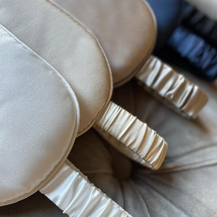 Pearl white and champagne silk eye masks with soft elasticated silk straps