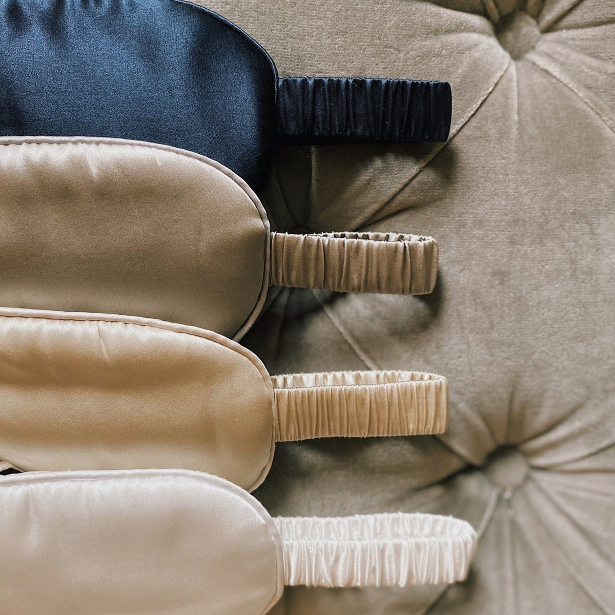 French navy, champagne and pearl white mulberry silk eye masks side by side