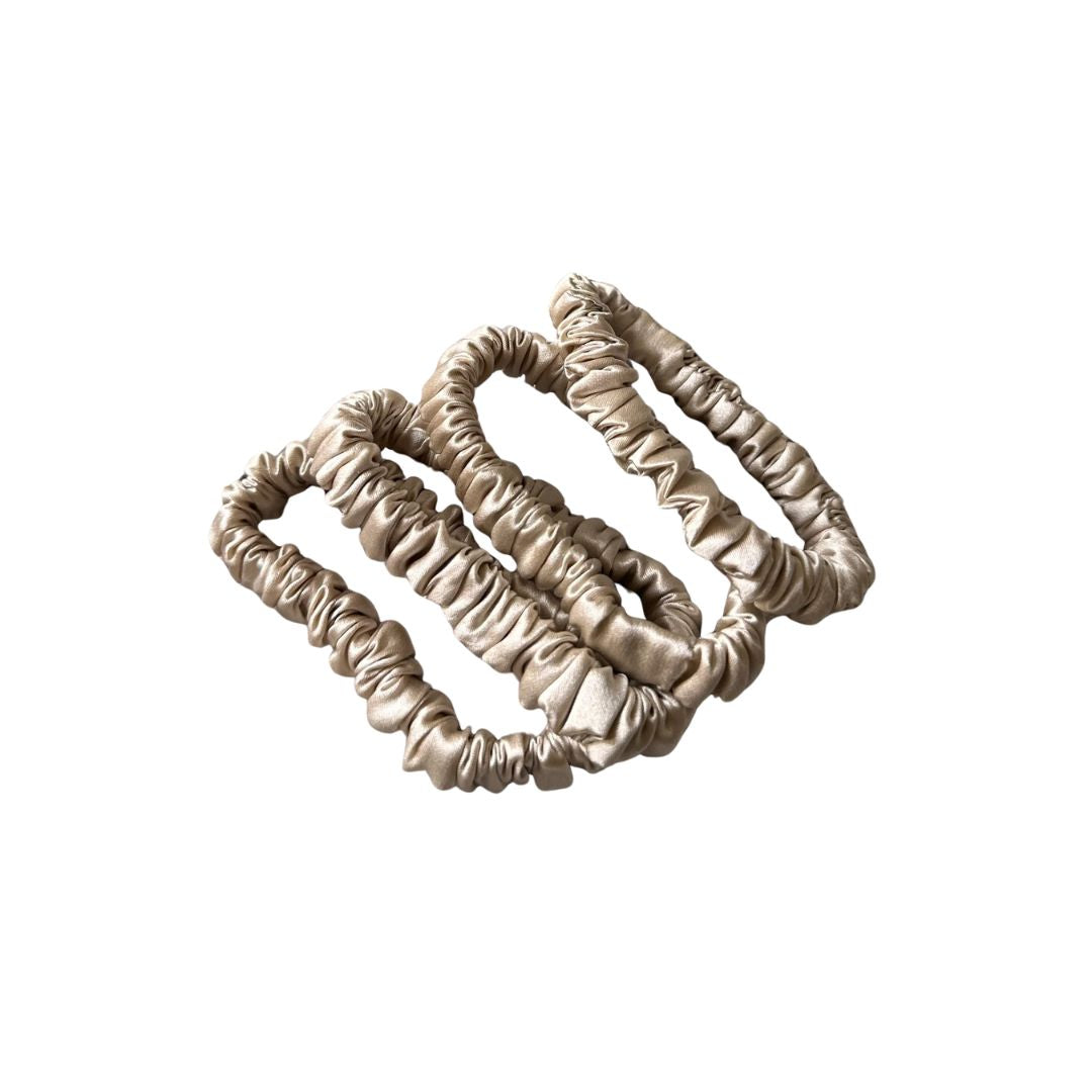 Champagne silk hair ties, a set of skinny 100% mulberry silk scrunchies that are gentle on hair