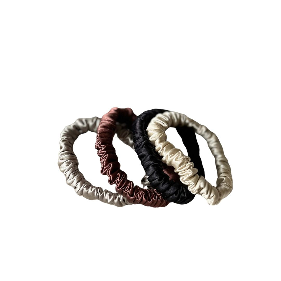 Natural collection silk hair ties in pearl white, chocolate brown, eclipse black and champagne