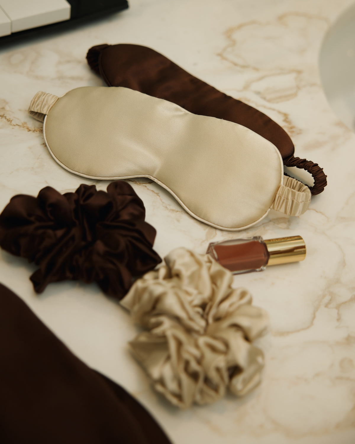 Champagne and espresso silk eye masks scrunchies marble still life