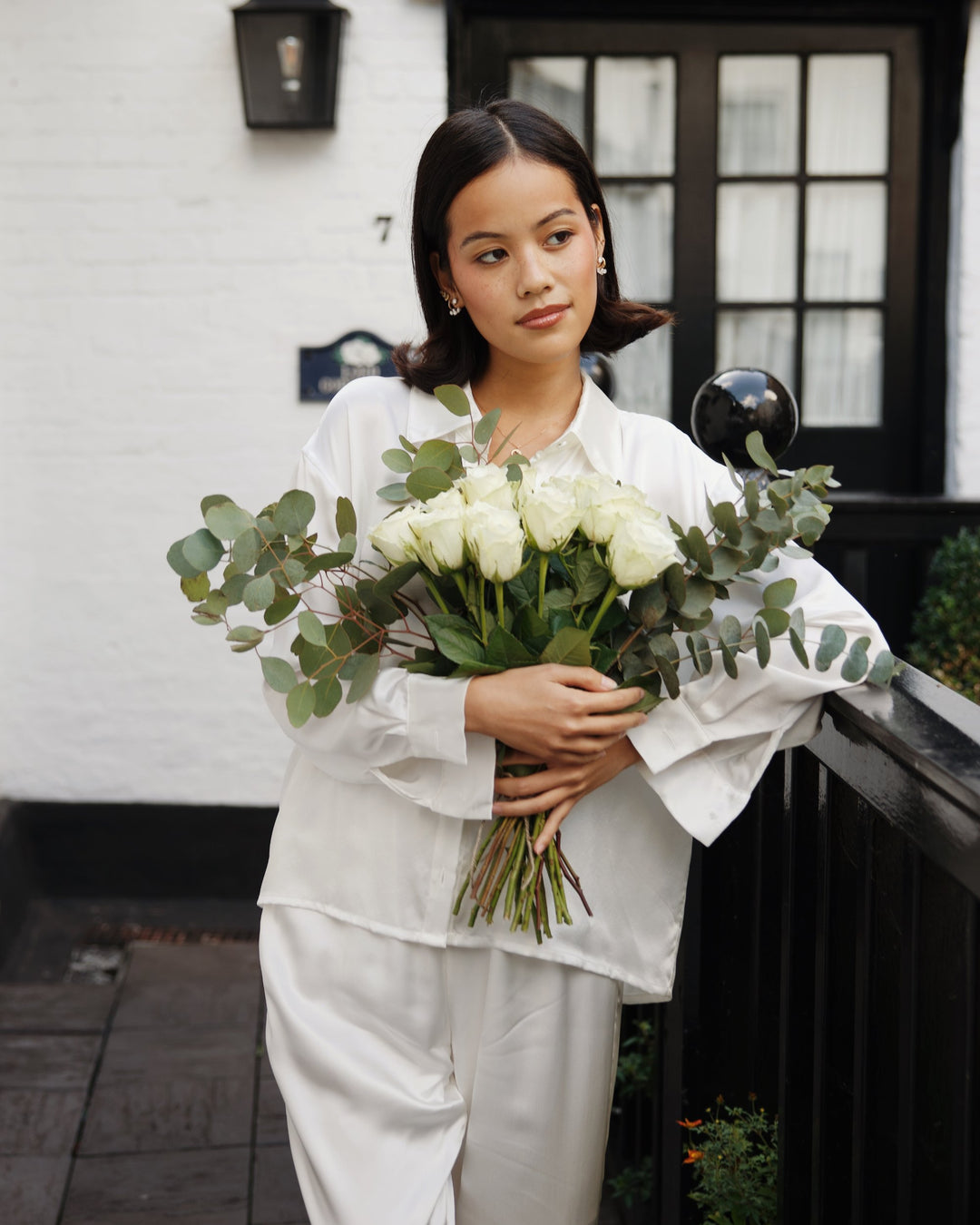 Pearl white silk pyjama set white roses outdoors bridal