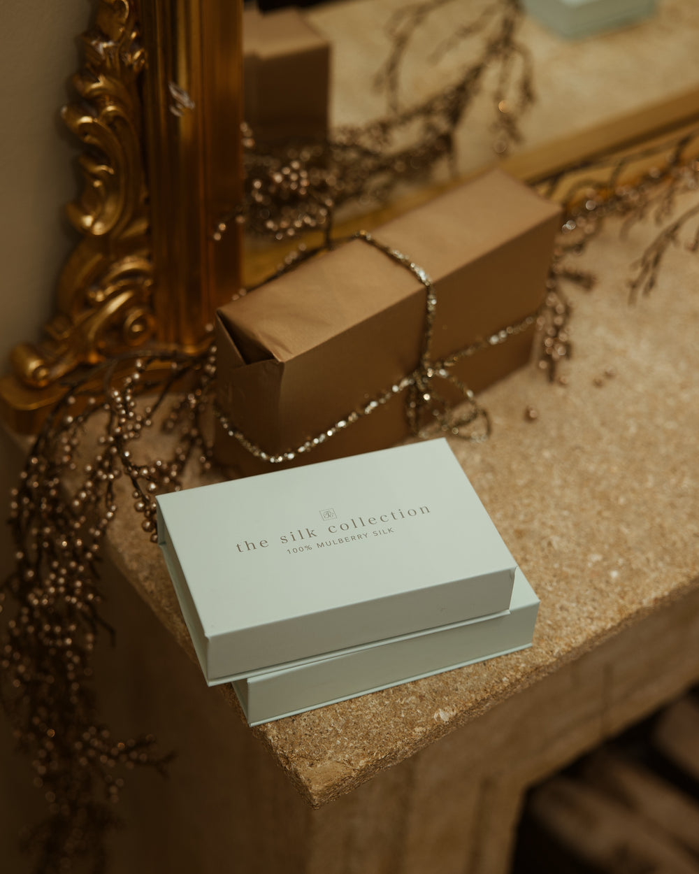 The Silk Collection gift boxes wrapped gift dresser gilt mirror still life